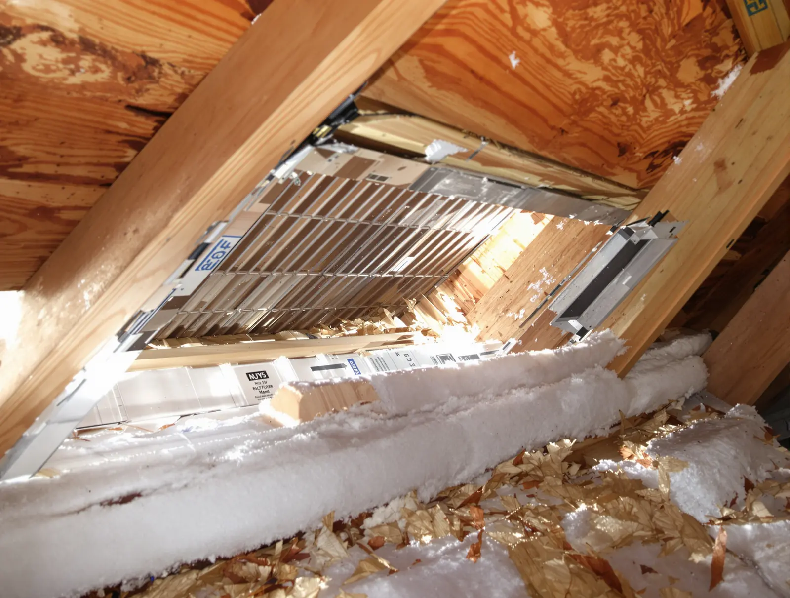 Rafter baffles installed between rafters creating a clear air channel from the soffit vent